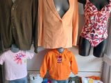 several mannequins and clothing displayed on display in a clothing store