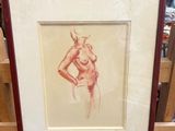 an image of a picture of a nude woman in a wooden frame