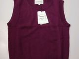 a purple sweater with a tag on the back of it