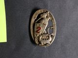 an image of a pin with a woman on it