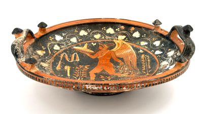 a black and orange bowl with an image of a man on a horse