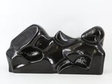 an image of a black sculpture of a cat and a dog