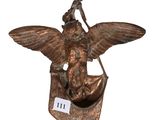 an image of a bronze statue of a bird holding a bag