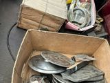 a box full of silver plates sitting on top of a table