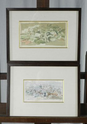 two framed pictures on a shelf next to each other