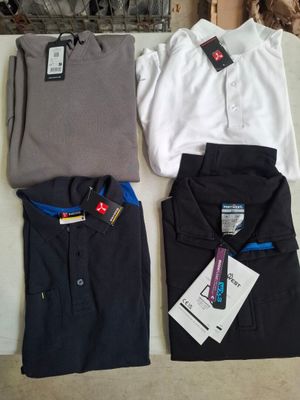 three men ' s shirts and a woman ' s shirt on a table