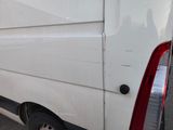 a white van that is parked on the side of the street