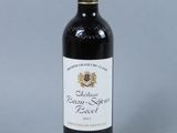 a bottle of wine that is sitting on a table