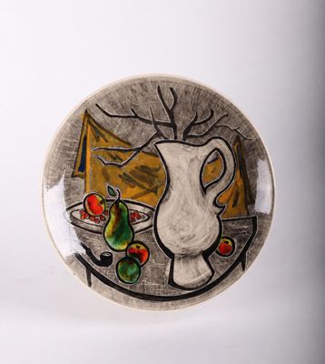 a plate with a painting of a pitcher and fruit on it