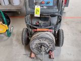 a machine that is sitting on the floor in the garage
