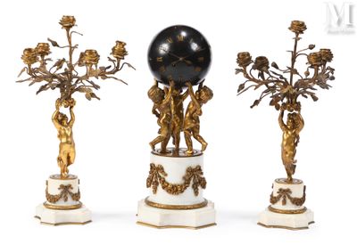 three antique figurines with a black globe on top of them