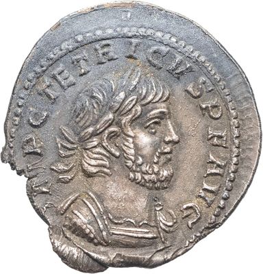 Gros plan sur une pièce de monnaie portant le visage d'un homme