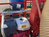 an image of a machine with a hose attached to it ' s side