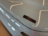 a close up of a car ' s hood with a sticker on it