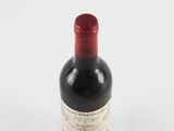 a bottle of wine that is sitting on a table