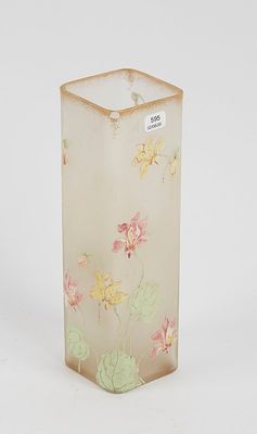 a glass vase with a flower design on it