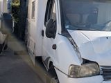 a white van that is parked next to another van