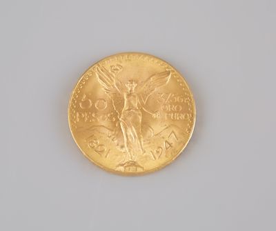 a gold coin with a picture of a woman on it