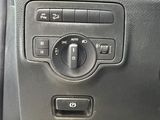 a close up of the controls on a car ' s dashboard