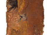 a close up of a piece of brown paper with a tree on it