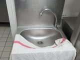 a sink with a towel on top of it in a kitchen
