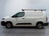 a white van that is parked in a room
