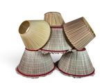 three lamps are stacked on top of each other on a white surface