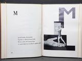 an open book with a picture of a woman in a bathing suit