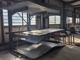 a large room with a lot of windows and a skateboard ramp