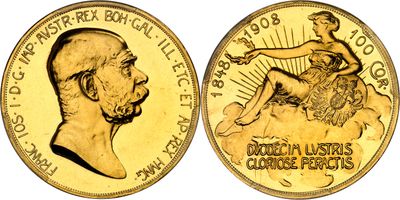 a close up of a gold coin with a woman on it