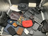 a suitcase filled with different types of bags and purses