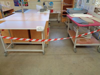 a table with a red and white striped tape around it