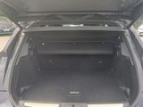 the back of a car with the trunk open and the trunk of the car in the back