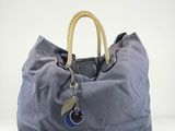 the large blue bag has a rope handle on it