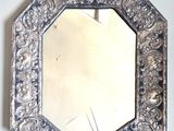 a mirror that is hanging on the wall in the room