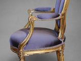 an image of a purple and gold chair on a grey background
