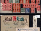 several different types of stamps and envelopes are displayed on a table