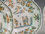 three plates with different designs on them on a table
