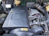 a picture of a car engine with its hood open