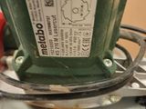 a close up of a green machine on a table
