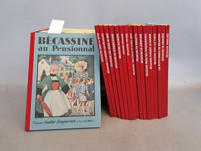 Plusieurs livres sont empilés les uns sur les autres devant une pile de livres