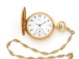 an image of a gold pocket watch with a chain on a white background