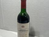 a bottle of wine that is sitting on a table