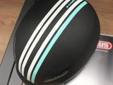 a black and white helmet with a blue stripe on it