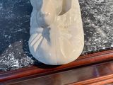 a statue of a dog sitting on top of a table