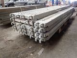 several pieces of steel are stacked on top of each other in a warehouse