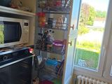 an image of a kitchen with an oven and a microwave