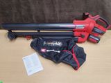 the corded blower is sitting on the table next to a bag