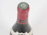 a bottle of wine that is sitting on a table