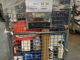 a metal cart with a sign on it in a warehouse